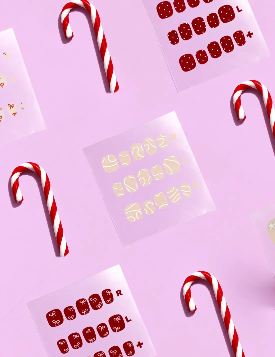 Sheets of festive nail art stick-on gels with candy canes