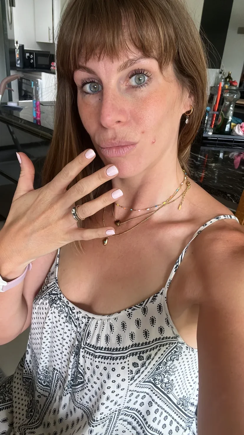 Customer wearing a pale pink Glaize manicure
